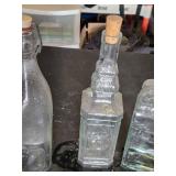 Collection of Vintage Glass Bottles and Jars