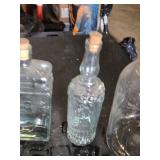 Collection of Vintage Glass Bottles and Jars