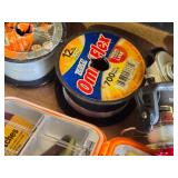 Fishing Gear Lot including Zebco OmniFlex, SpiderWire Stealth, and Ozark Trail Monofilament Lines, Reels, and Tackle Box