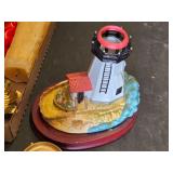 Box of Assorted Candles, Decorative Lighthouse, and Candle Holders