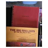 Assorted Music Books and Instructional Materials Notable titles include "Scott Joplin: King of Ragtime," "The Big Ballads of the 70s, 60s, & 50s," and "Foundations in Singing."