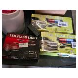 LED lights, wiring, and paint supplies including LED Flash Light Boxes, Various Cords, and Assorted Paints