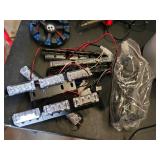 LED lights, wiring, and paint supplies including LED Flash Light Boxes, Various Cords, and Assorted Paints