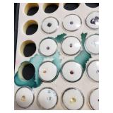 Loose gemstones collection in display case including various cuts and colors