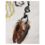 Lot of Jewelry Including Feather Necklace, Beaded Bracelets, and Decorative Pendants