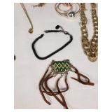 Mixed Jewelry Collection including Necklaces, Bracelets, and Pendants