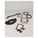 Assorted Bracelets and Bangles Jewelry Collection including Beaded, Metal, and Leather Designs