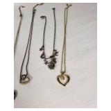 Lot of Necklaces and Pendants Featuring Heart Designs and Various Chains