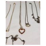 Lot of Necklaces and Pendants Featuring Heart Designs and Various Chains