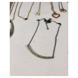 Lot of Necklaces and Pendants Featuring Heart Designs and Various Chains