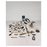 Assorted Jewelry Lot Including Vintage Brooches, Pendants, and Charms