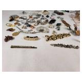 Assorted Jewelry Lot Including Vintage Brooches, Pendants, and Charms