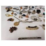 Assorted Jewelry Lot Including Vintage Brooches, Pendants, and Charms