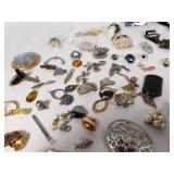 Assorted Jewelry Lot Including Vintage Brooches, Pendants, and Charms