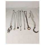 Assorted Necklaces and Pendants Including Moon and Butterfly Designs