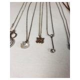 Assorted Necklaces and Pendants Including Moon and Butterfly Designs