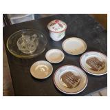 Set of Vintage plates featuring buildings with "I.O.O.F." and "1914" markings , Glass Juicer, and Christmas-Themed Jar