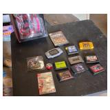 Assorted Video Games, Console, and Accessories Lot including VR Real Feel Racing, Game Boy Advance, and Sega Genesis Cartridges