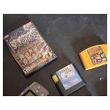 Assorted Video Games, Console, and Accessories Lot including VR Real Feel Racing, Game Boy Advance, and Sega Genesis Cartridges