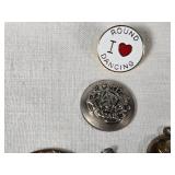 Assorted Jewelry and Pins including Brooches, Medallions, and Charms