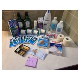 Assortment of bathroom essentials - unopened soap, eye drops, bandages, vintage razor, Witch Hazel, and more
