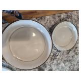 white and silver rimed dishes