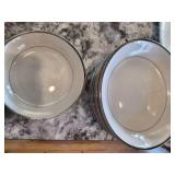 white and silver rimed dishes