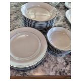 white and silver rimed dishes