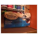 Box of art supplies including paint