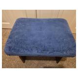 Vintage wooden footrest with blue cushioned top