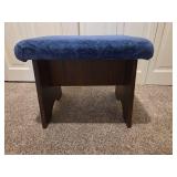 Vintage wooden footrest with blue cushioned top