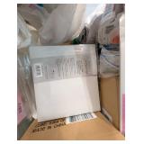 Bin of scrapbook/album sheets, tape and supplies