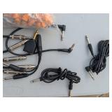 Assortment of xlr, 3.5, 1/4" audio cables and adapters.