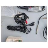Assortment of xlr, 3.5, 1/4" audio cables and adapters.