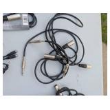 Assortment of xlr, 3.5, 1/4" audio cables and adapters.