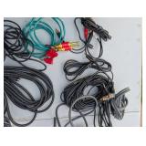 Assortment of xlr, 3.5, 1/4" audio cables and adapters.