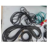 Assortment of xlr, 3.5, 1/4" audio cables and adapters.