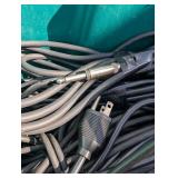 Assortment of xlr, 3.5, 1/4" audio cables and adapters.