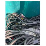 Assortment of xlr, 3.5, 1/4" audio cables and adapters.
