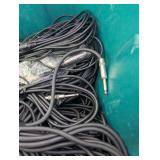 Assortment of xlr, 3.5, 1/4" audio cables and adapters.