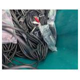 Assortment of xlr, 3.5, 1/4" audio cables and adapters.
