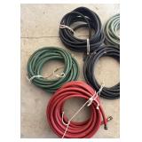 G - Six Solid Rubber Coiled Hoses