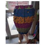 Colorful, Layered Patchwork Skirt Featuring Circular Patterns.