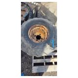 Three Carlisle Tractor Tires on Rusted Rims