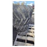 Three Carlisle Tractor Tires on Rusted Rims