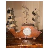Vintage United Clock Corp Ship Clock & Lamp featuring a wooden body and metal sails.