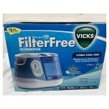 NEW in box Vicks Filter-Free Cool Mist Humidifier. Low maintenance, no filters to replace! Large 1-gallon tank runs 18-24 hours. Features a VapoPad heater for soothing menthol scent. Perfect for mediu