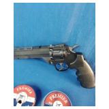 Crosman Vigilante CO2 revolver air pistol accompanied by two tins of .177 caliber Premier pellets.