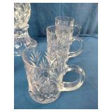 This set resembles Waterford Lismore crystal Irish coffee mugs and a matching hurricane candle holder