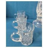 This set resembles Waterford Lismore crystal Irish coffee mugs and a matching hurricane candle holder